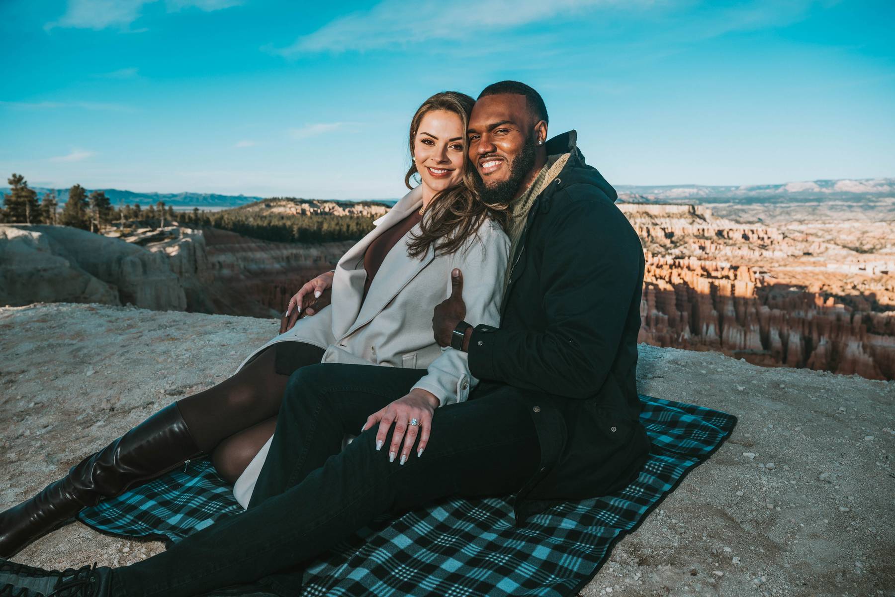 unique surprise proposal and engagement photos in a perfect location with the perfect backdrop and happy couple brought together