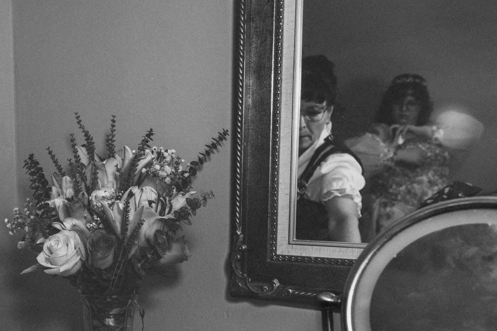 bride and their mom getting ready in their airbnb in utah
