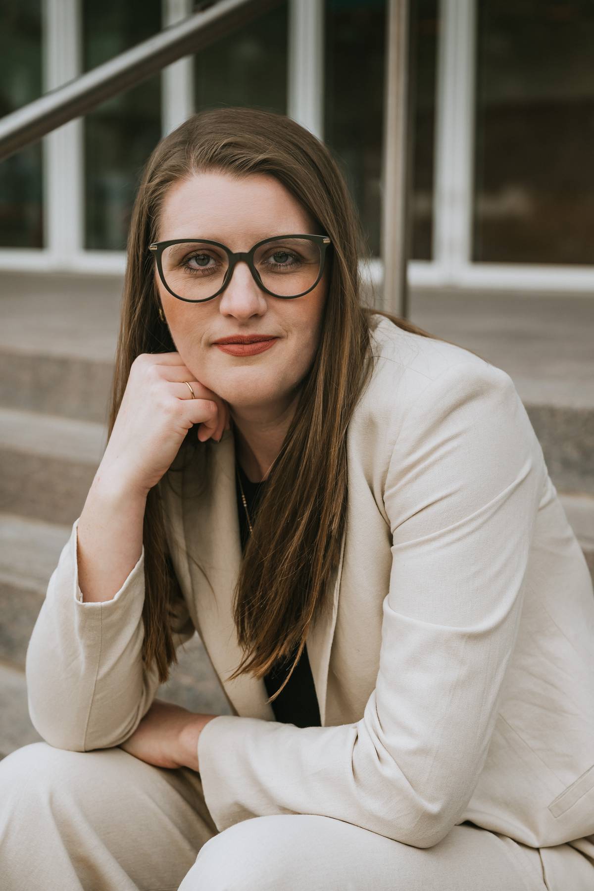 Salt Lake City photographer capturing natural expressions during headshot session shaping and apply as a boss during happy hour and serve to understand